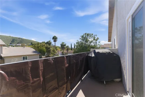 a balcony with wooden floor
