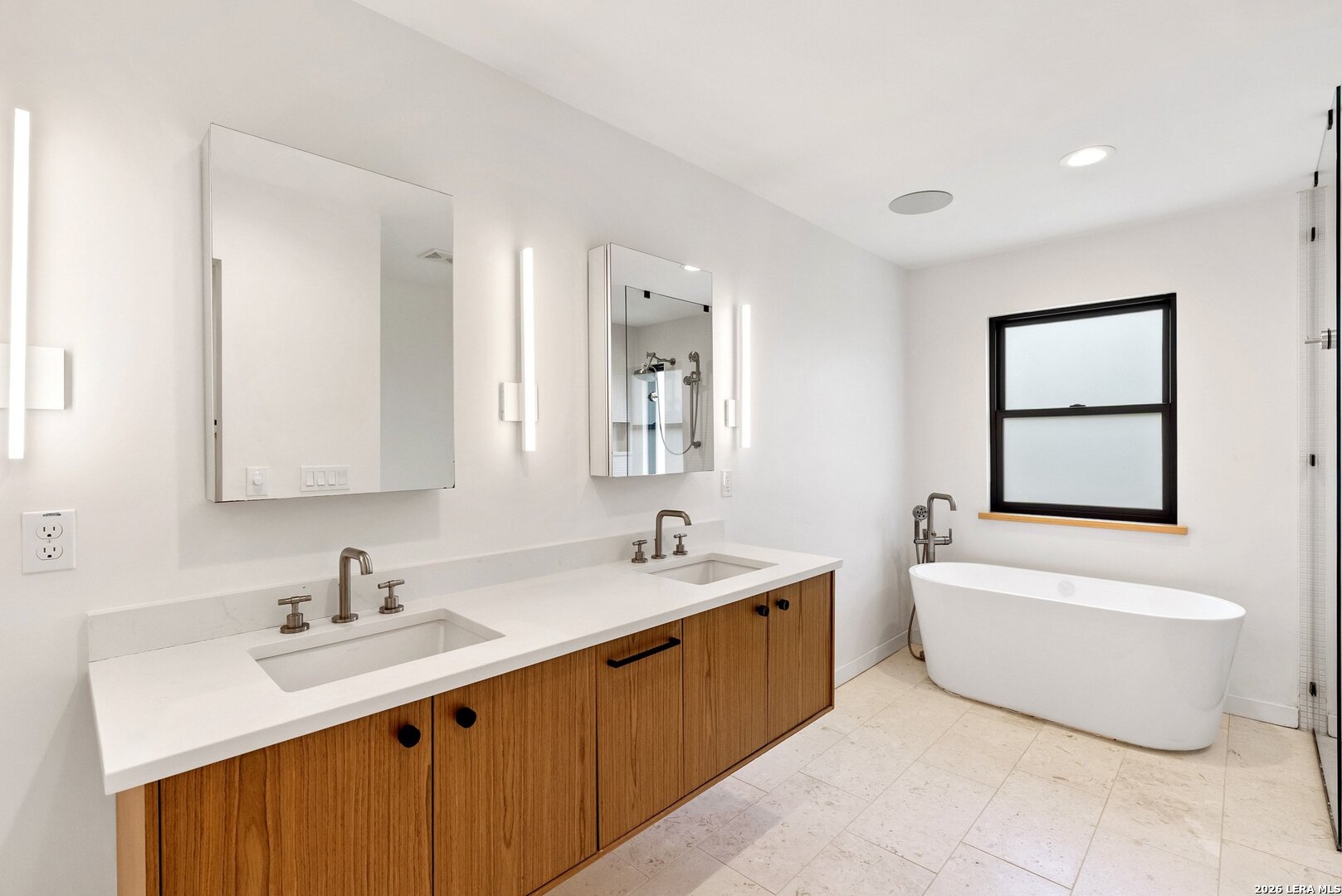 1402 Hutto Road Georgetown, TX 78626 - Photo 27 of 34 a bathroom with a double vanity sink mirror and bathtub