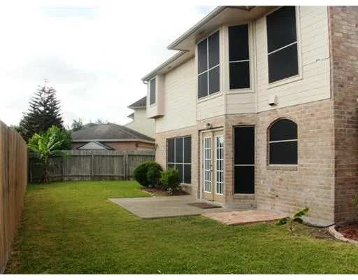 a view of a back yard of the house