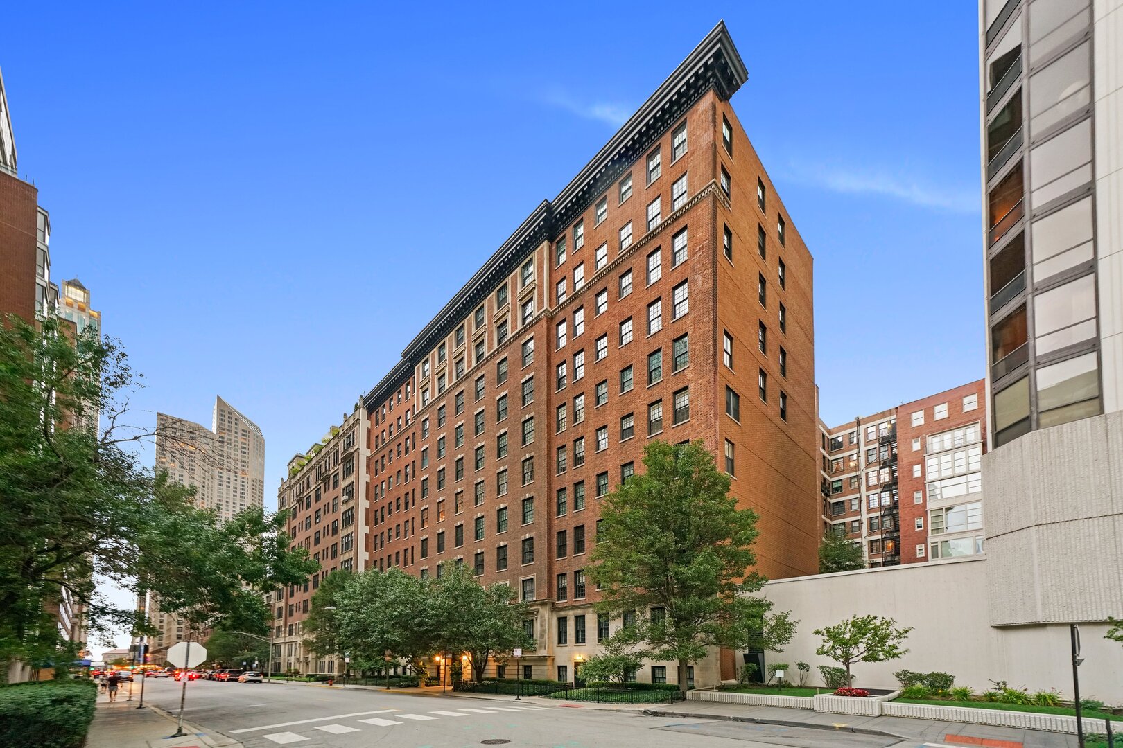 a view of a tall building next to a road