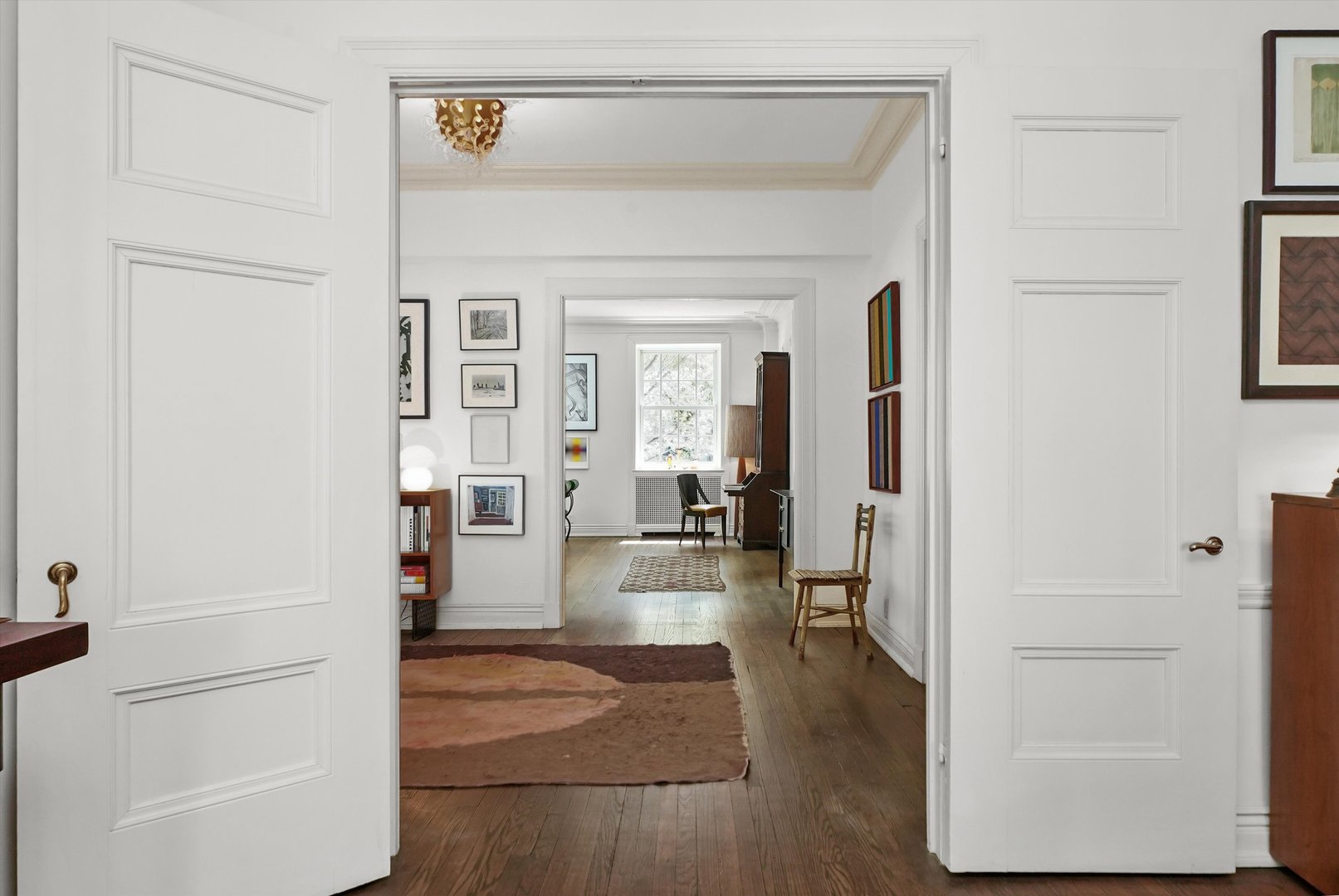 232 East Walton Place, Unit 3W Chicago, IL 60611 - Photo 34 of 50 a view of a hallway with wooden floor and dining room view