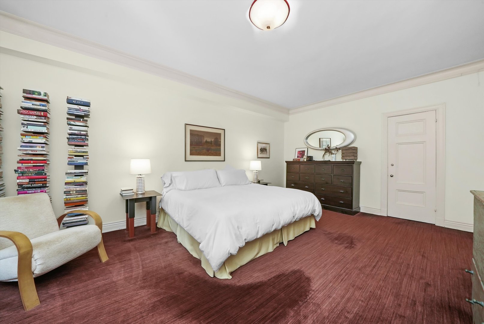 232 East Walton Place, Unit 3W Chicago, IL 60611 - Photo 36 of 50 a spacious bedroom with a large bed and a couch