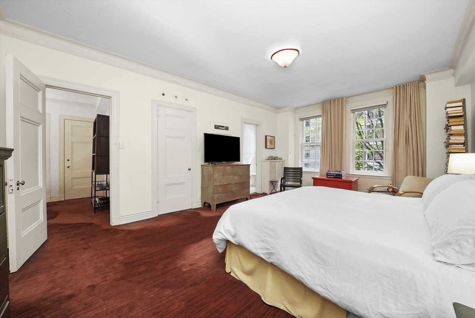 232 East Walton Place, Unit 3W Chicago, IL 60611 - Photo 37 of 50 a spacious bedroom with a bed and a flat screen tv