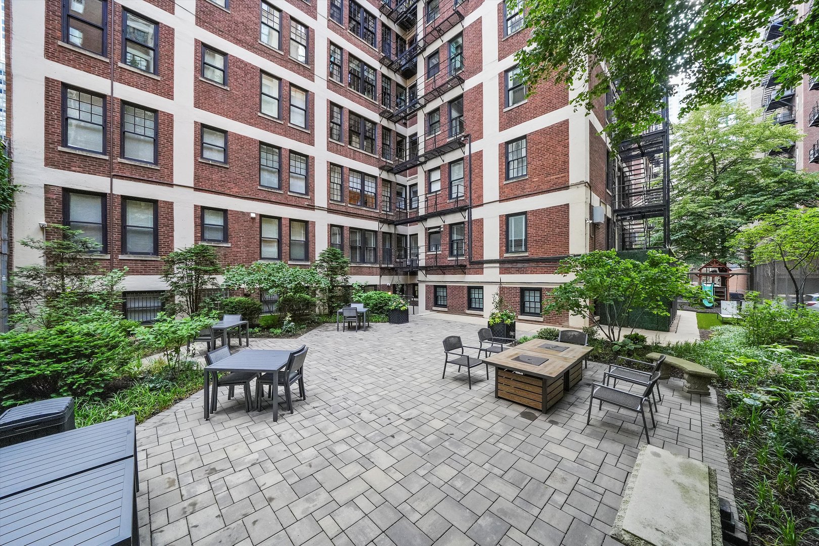 232 East Walton Place, Unit 3W Chicago, IL 60611 - Photo 43 of 50 a building outdoor space with patio furniture and potted plants