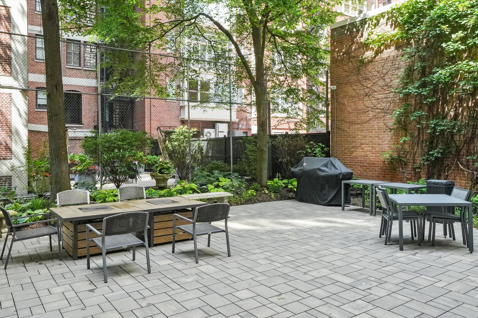 232 East Walton Place, Unit 3W Chicago, IL 60611 - Photo 46 of 50 a view of a chairs and table in backyard of the house