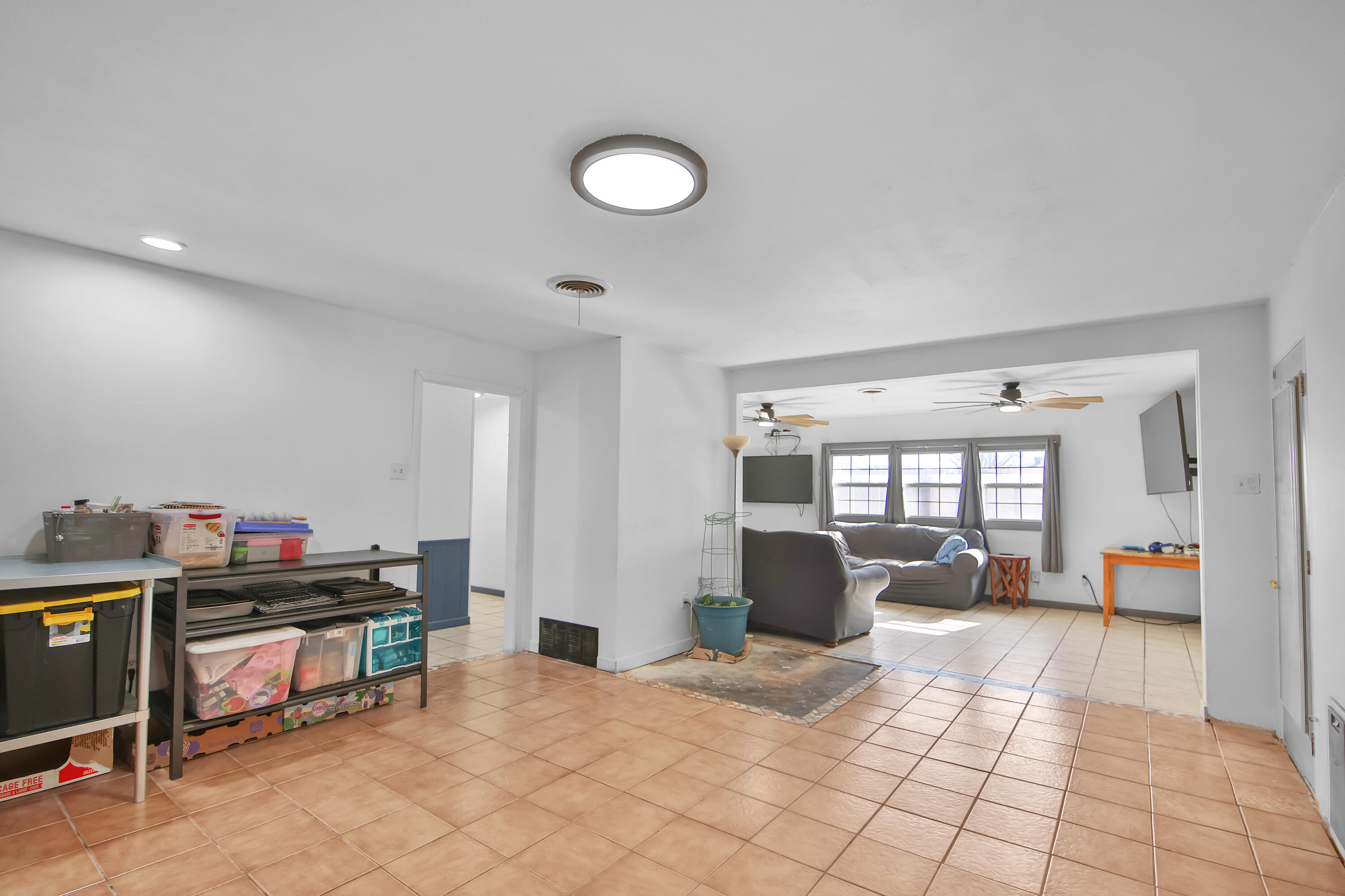 2801 52nd Street Lubbock, TX 79413 - Photo 11 of 34 a view of a workspace with furniture and a livingroom
