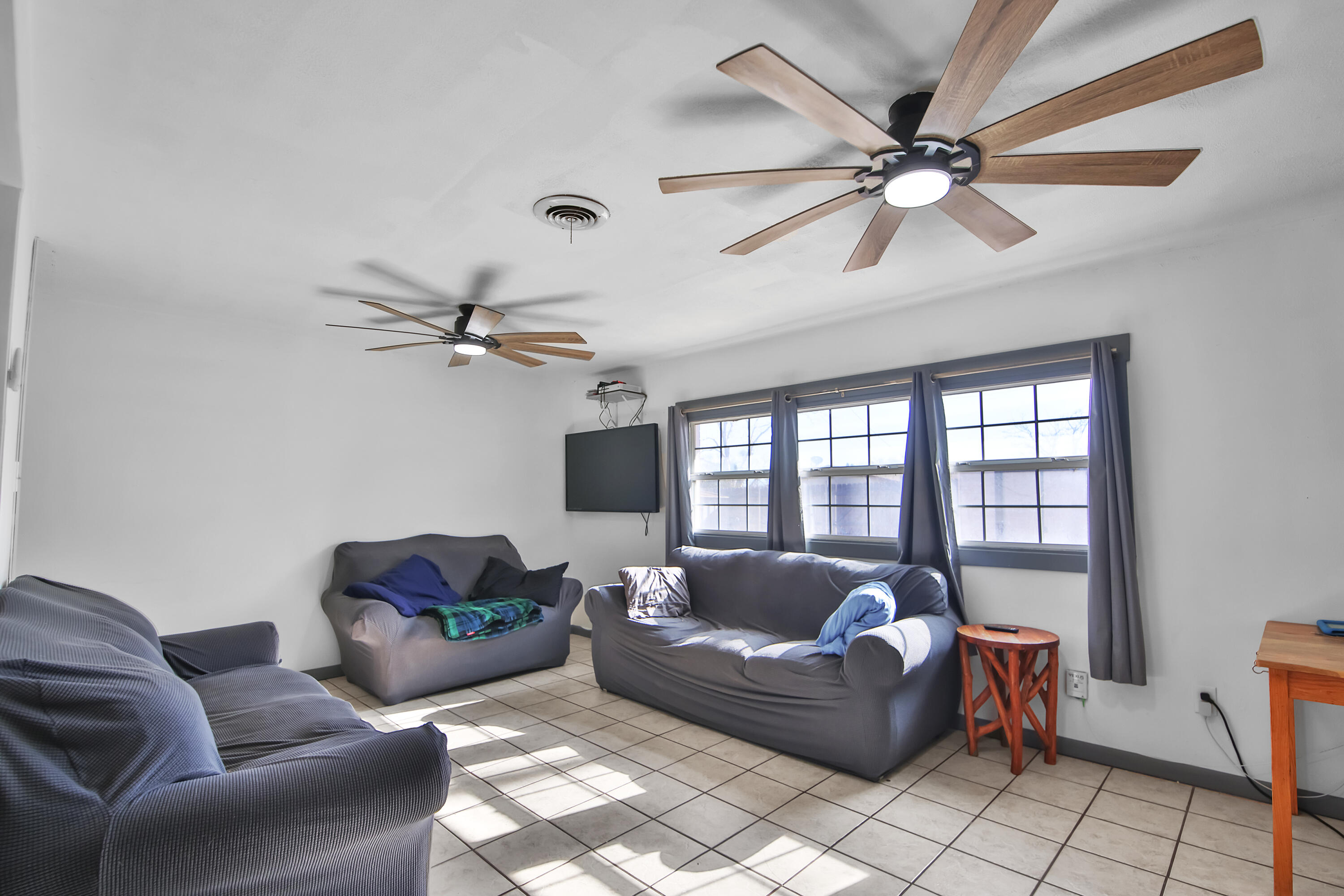 2801 52nd Street Lubbock, TX 79413 - Photo 13 of 34 a living room with furniture and a window