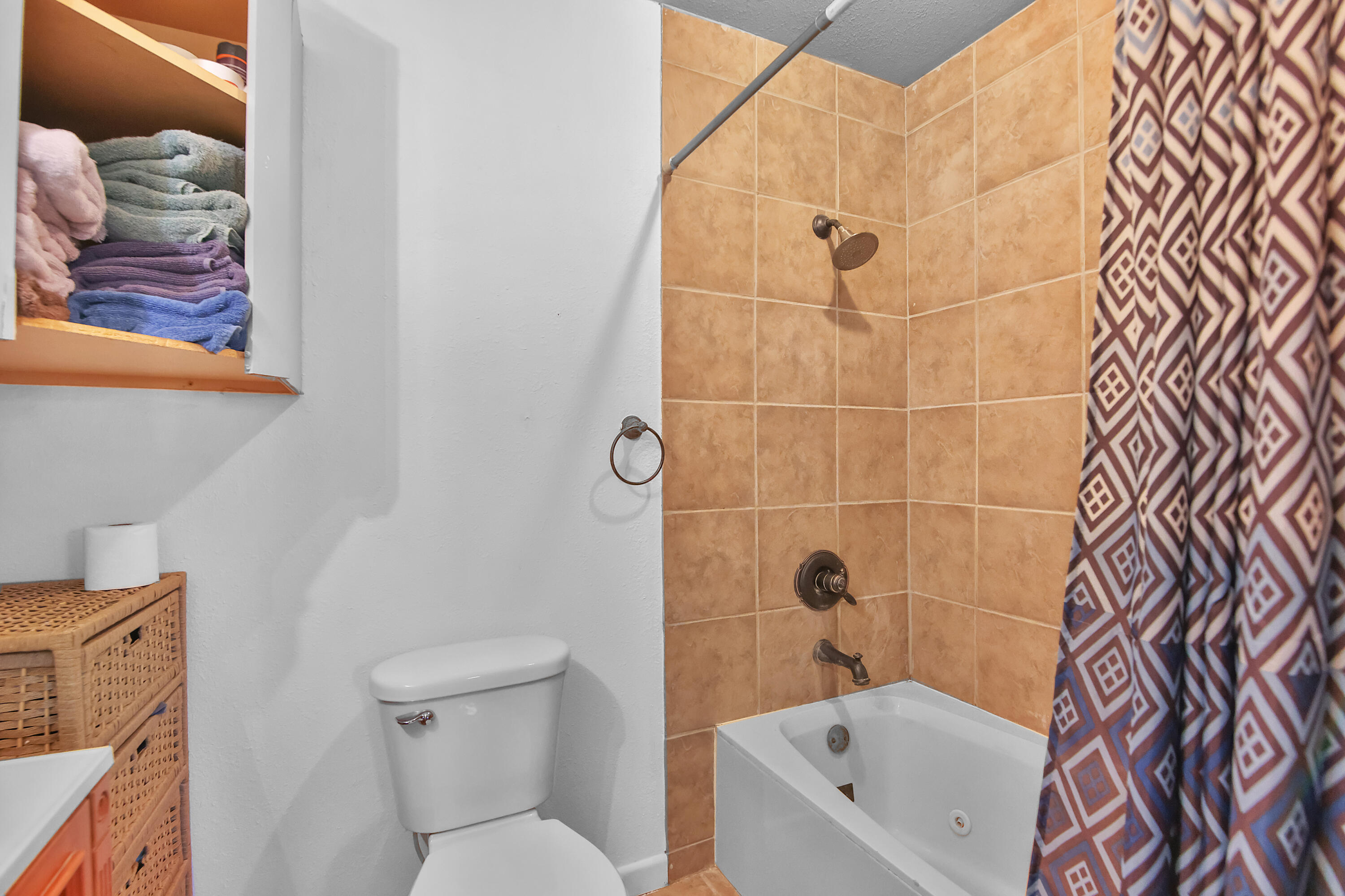2801 52nd Street Lubbock, TX 79413 - Photo 25 of 34 a bathroom with a toilet and a shower