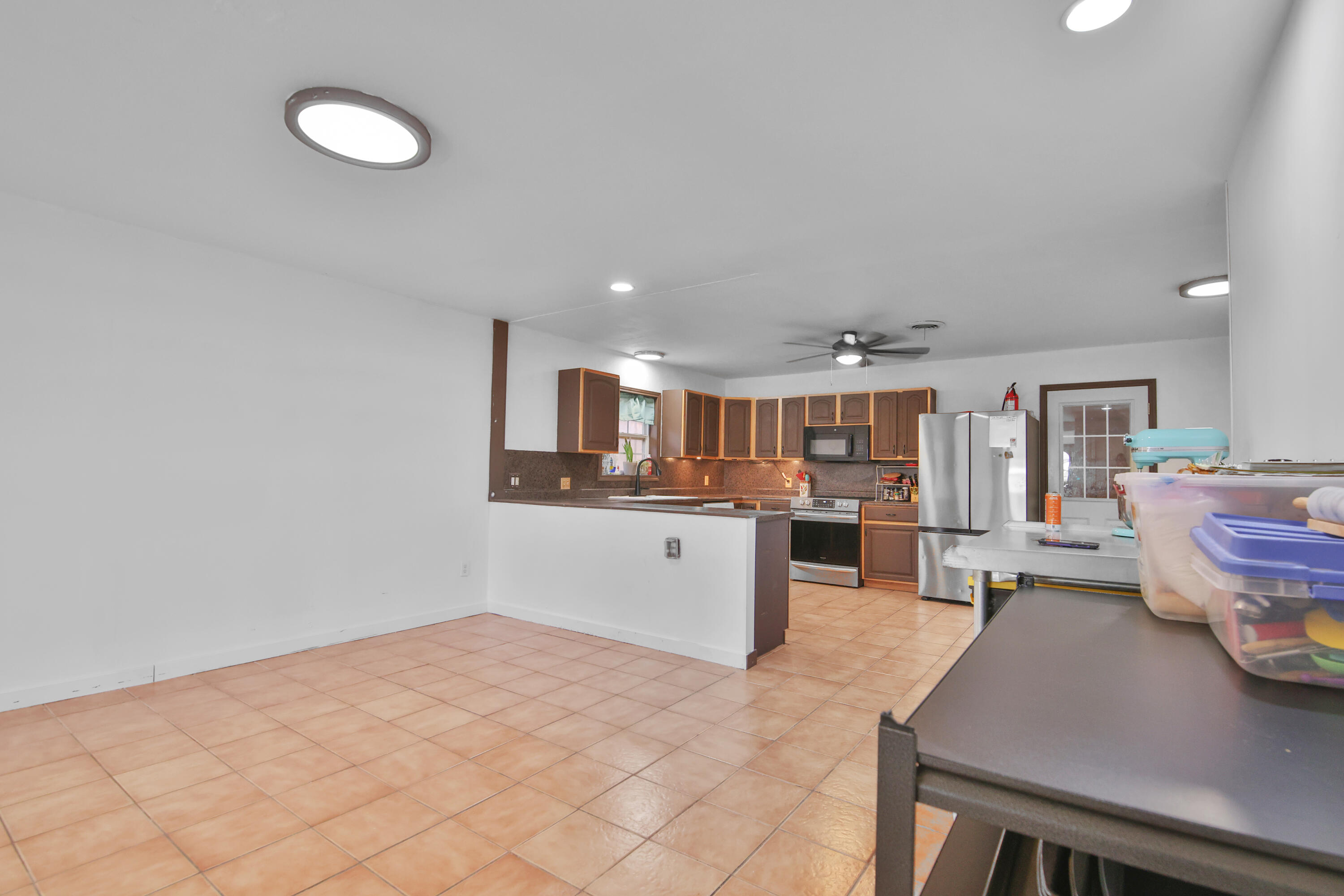 2801 52nd Street Lubbock, TX 79413 - Photo 6 of 34 a large white kitchen with sink and cabinets
