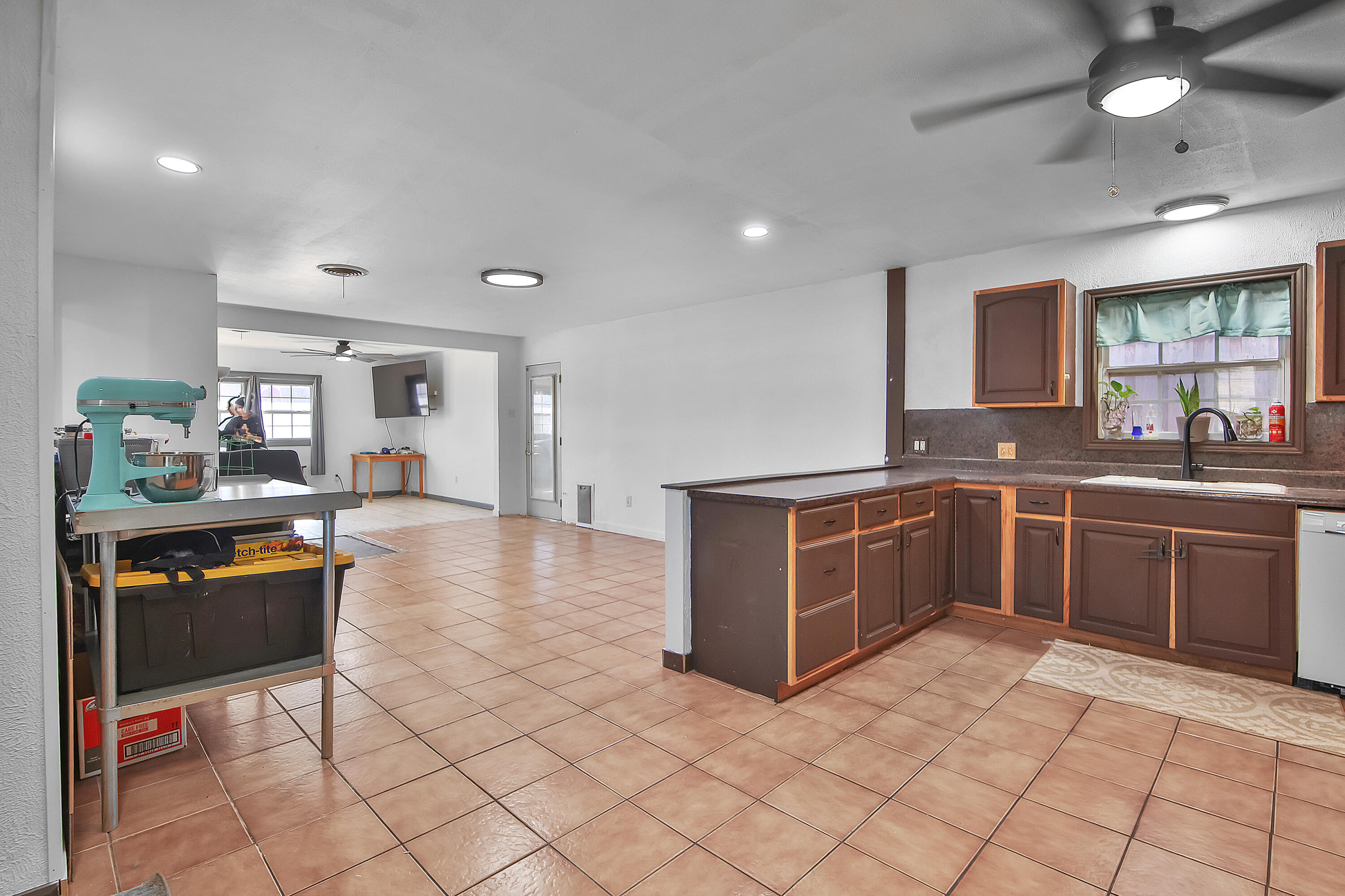 2801 52nd Street Lubbock, TX 79413 - Photo 10 of 34 a kitchen with stainless steel appliances granite countertop a stove and a sink