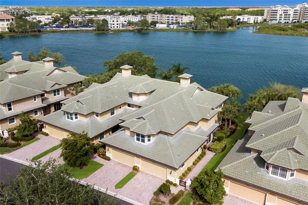 6431 Moorings Point Circle, Unit 202 Lakewood Ranch, FL 34202 - Photo 4 of 4 an aerial view of a house with a lake view