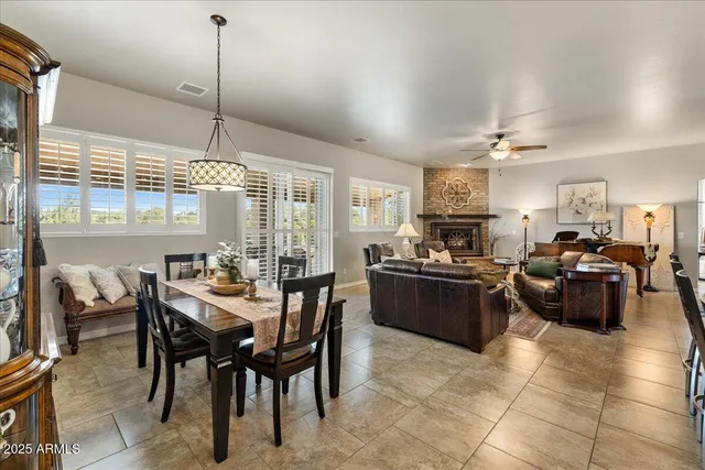 a large kitchen with a table and chairs