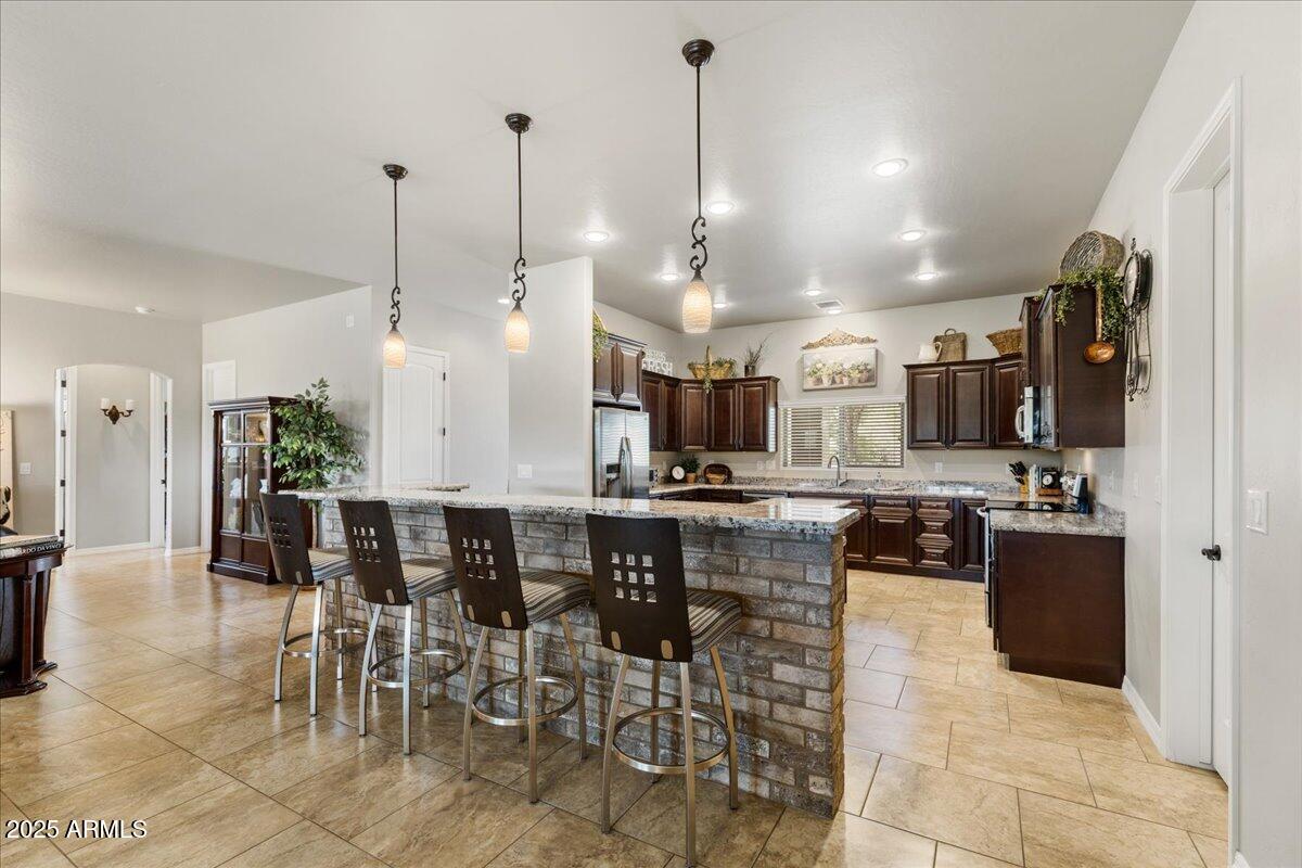 2135 West Bridle Path Road Prescott, AZ 86305 - Photo 8 of 32 a large kitchen with a table and chairs