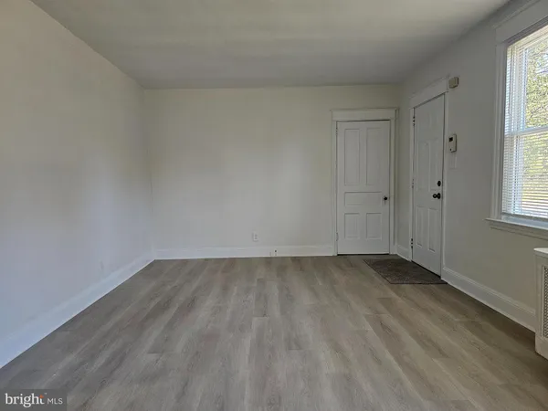 a view of an empty room and window