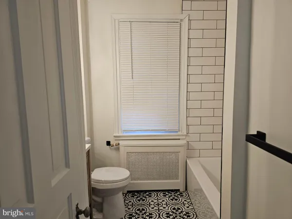 a bathroom with a sink and toilet