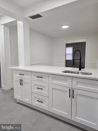 a bathroom with a sink and mirror