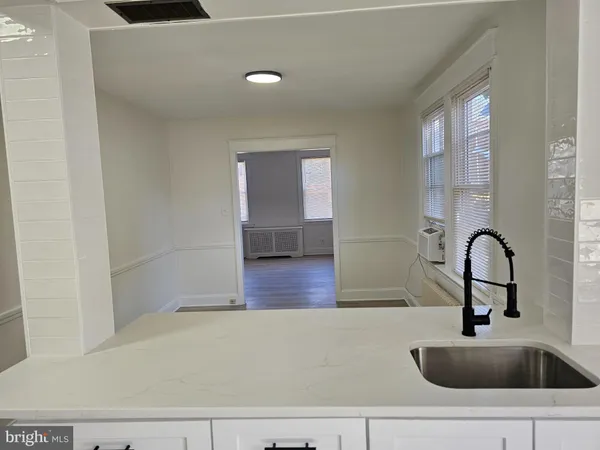 a bathroom with a sink and mirror