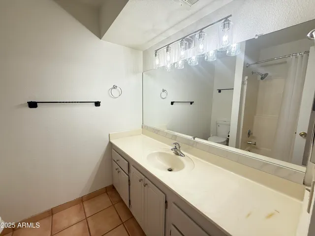 a bathroom with a sink and mirror