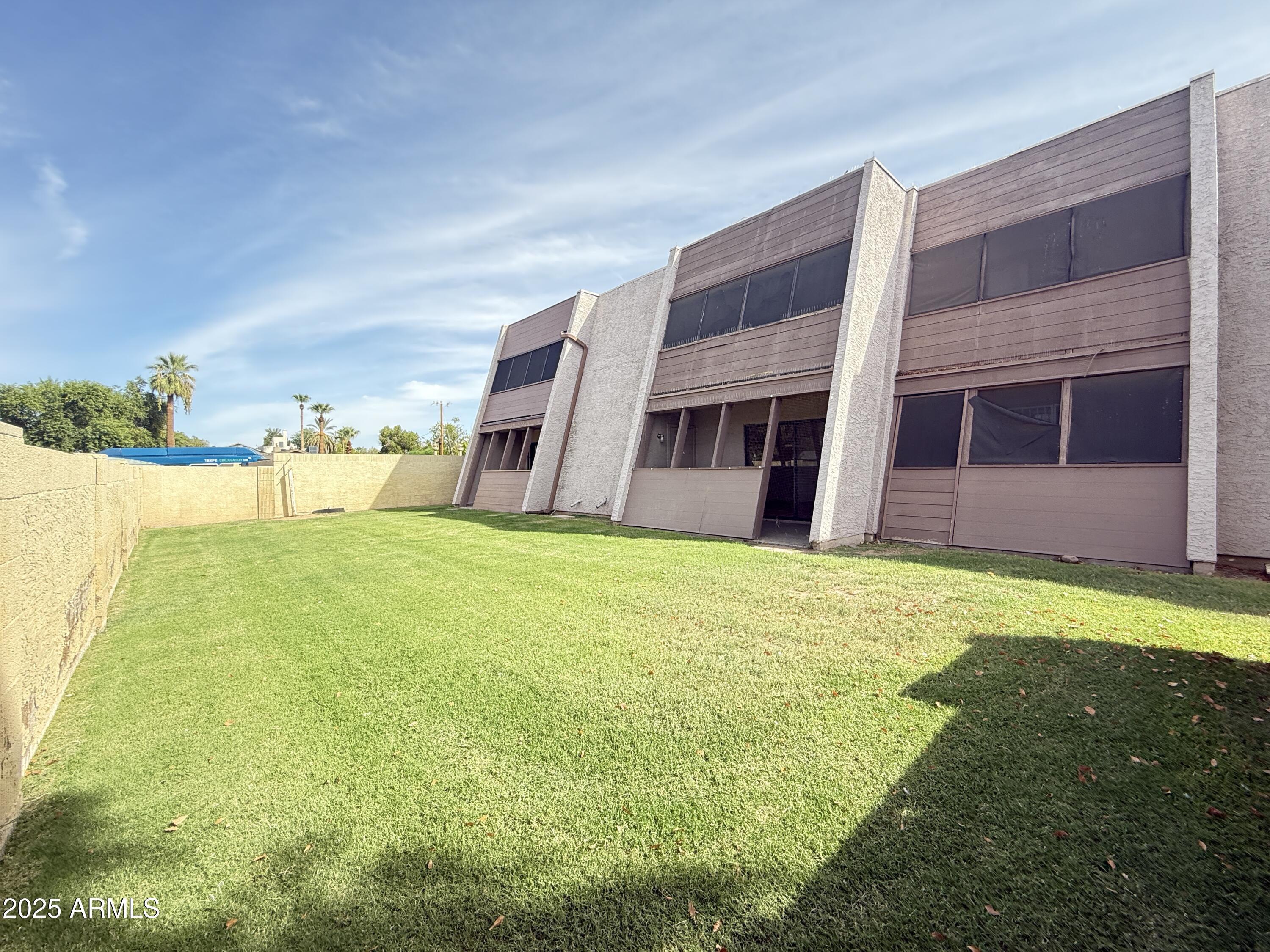 611 West 13th Street Tempe, AZ 85281 - Photo 22 of 30 a swimming pool with outdoor seating and yard