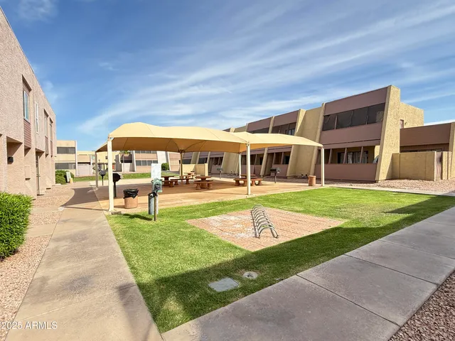 a front view of building with yard