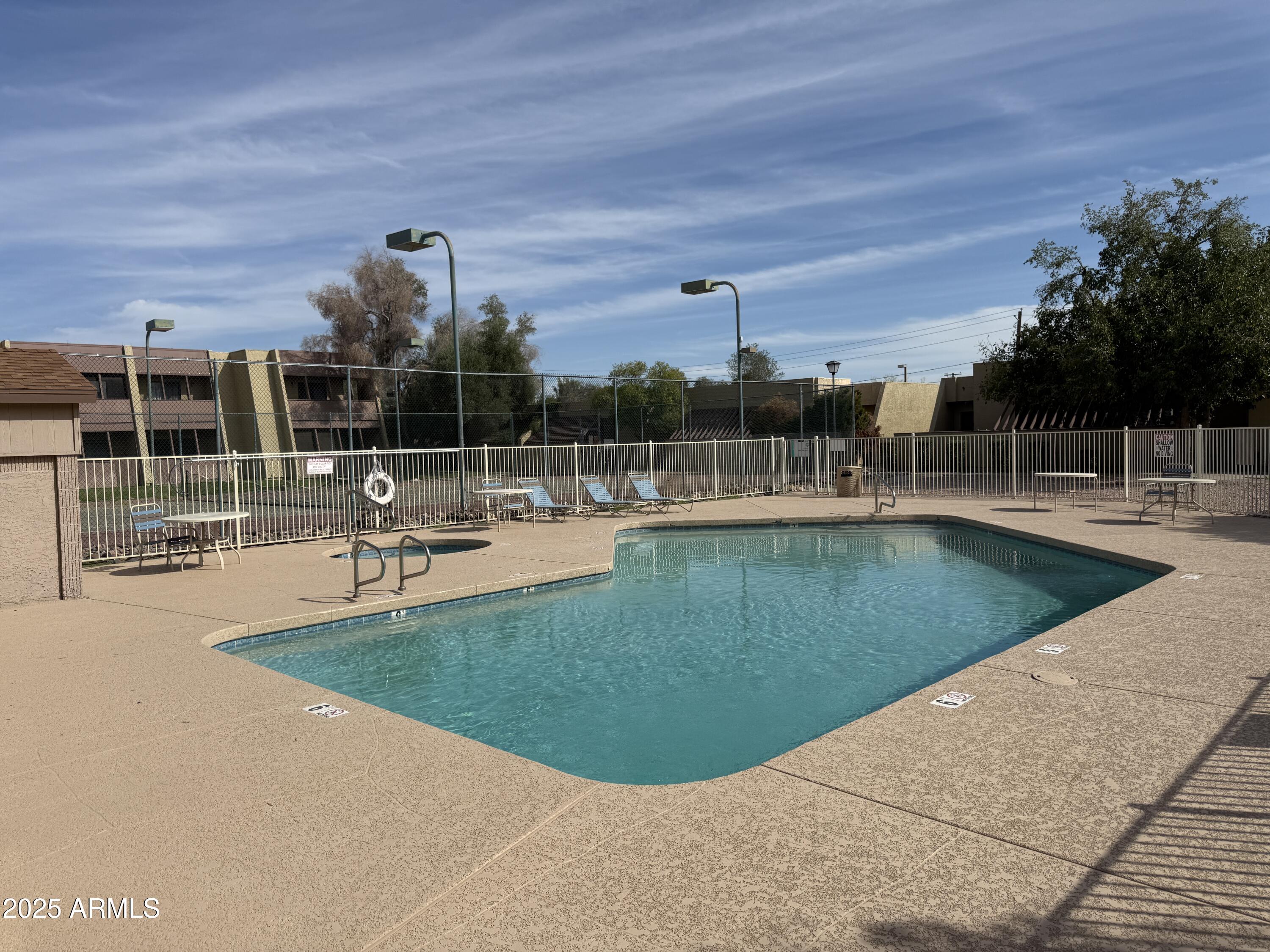 611 West 13th Street Tempe, AZ 85281 - Photo 28 of 30 a view of a swimming pool with a patio