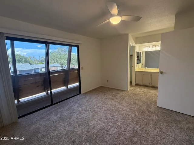 a view of empty room with floor to ceiling window