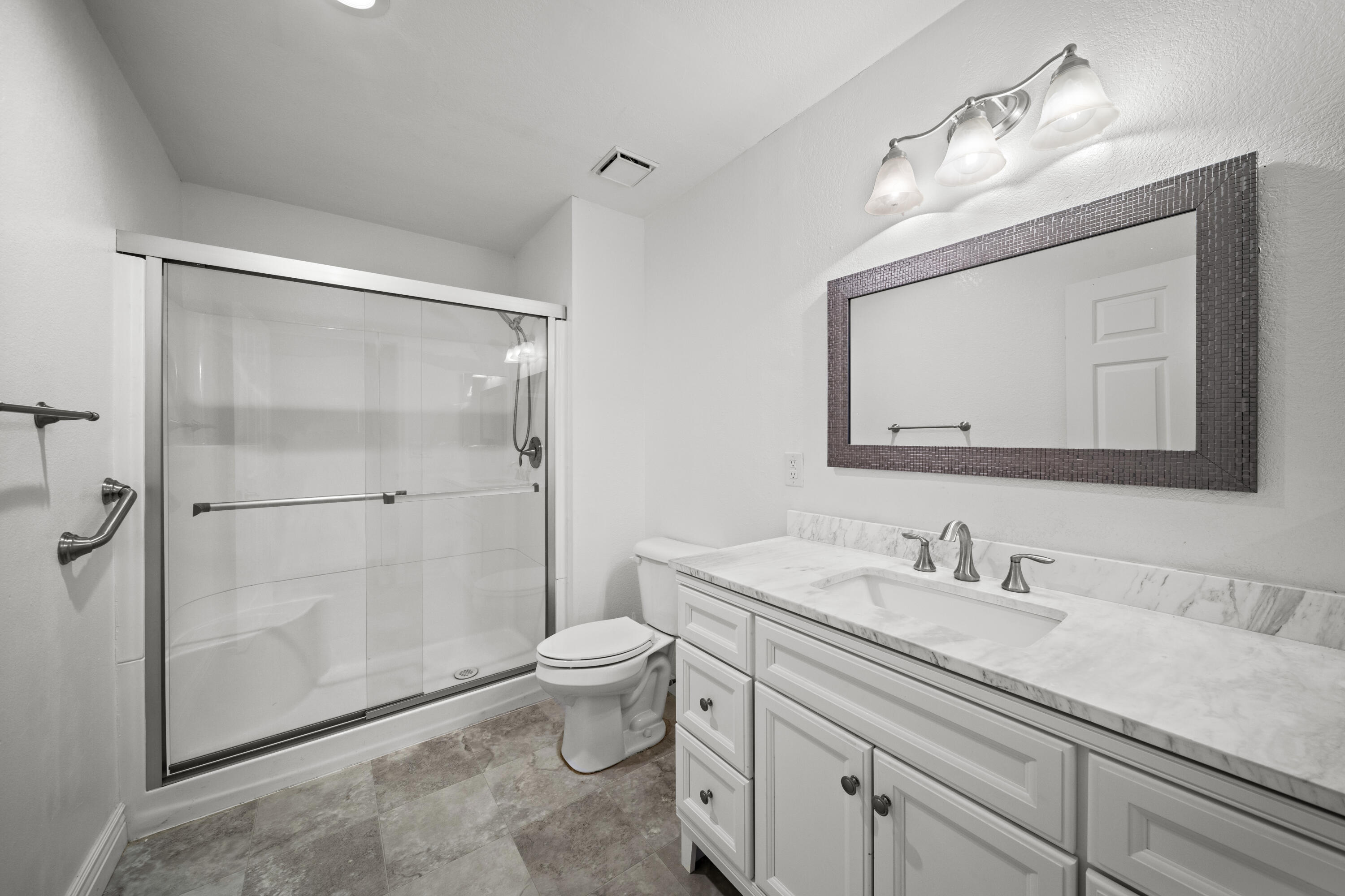 6014 Mid Drive Trail Redding, CA 96003 - Photo 8 of 15 a bathroom with a sink a toilet and shower