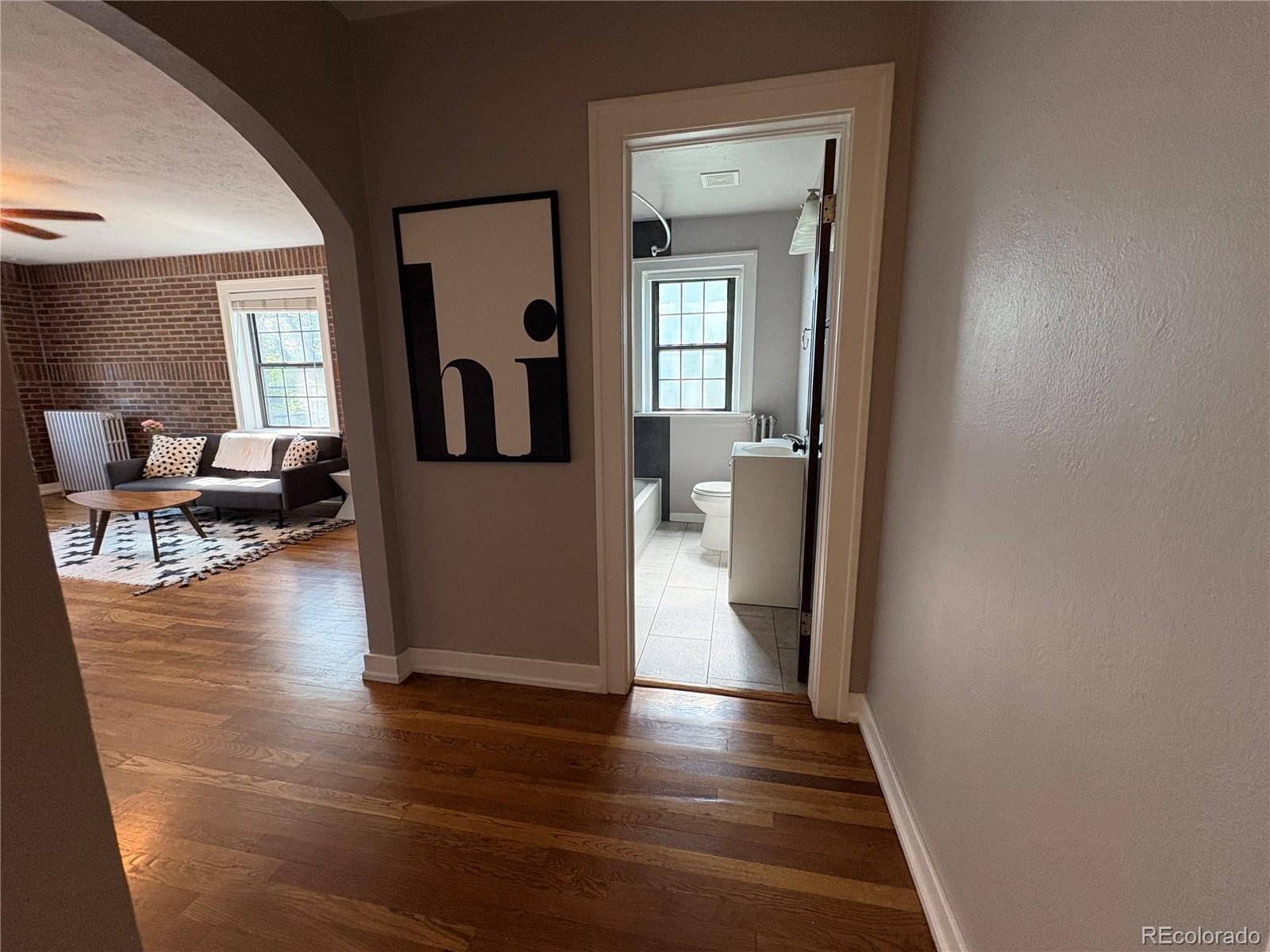1684 Harrison Street, Unit 8 Denver, CO 80206 - Photo 5 of 21 wooden floor with a window