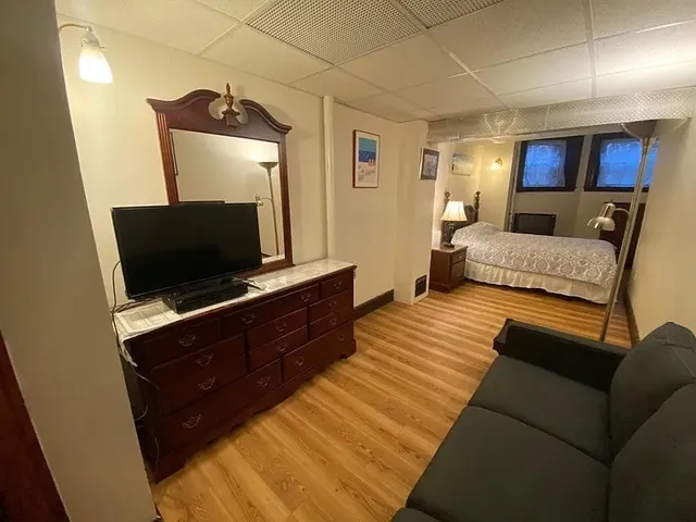 a living room with furniture and a flat screen tv