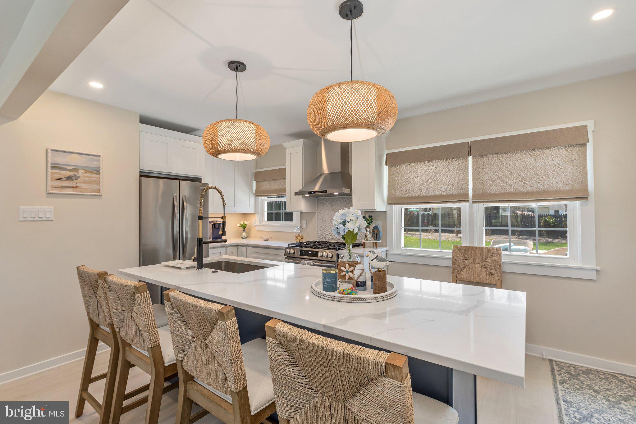 126 Colwick Drive Somers Point, NJ 08244 - Photo 12 of 46 a dining room with furniture a chandelier and wooden floor