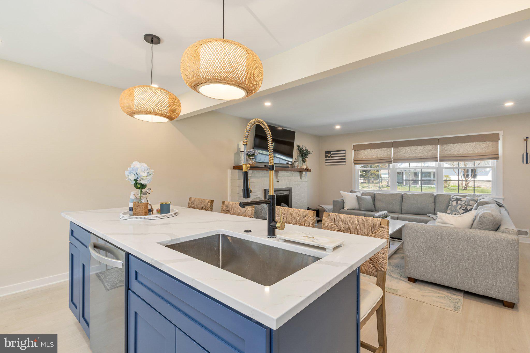 126 Colwick Drive Somers Point, NJ 08244 - Photo 14 of 46 a kitchen with a sink a counter space and living room view
