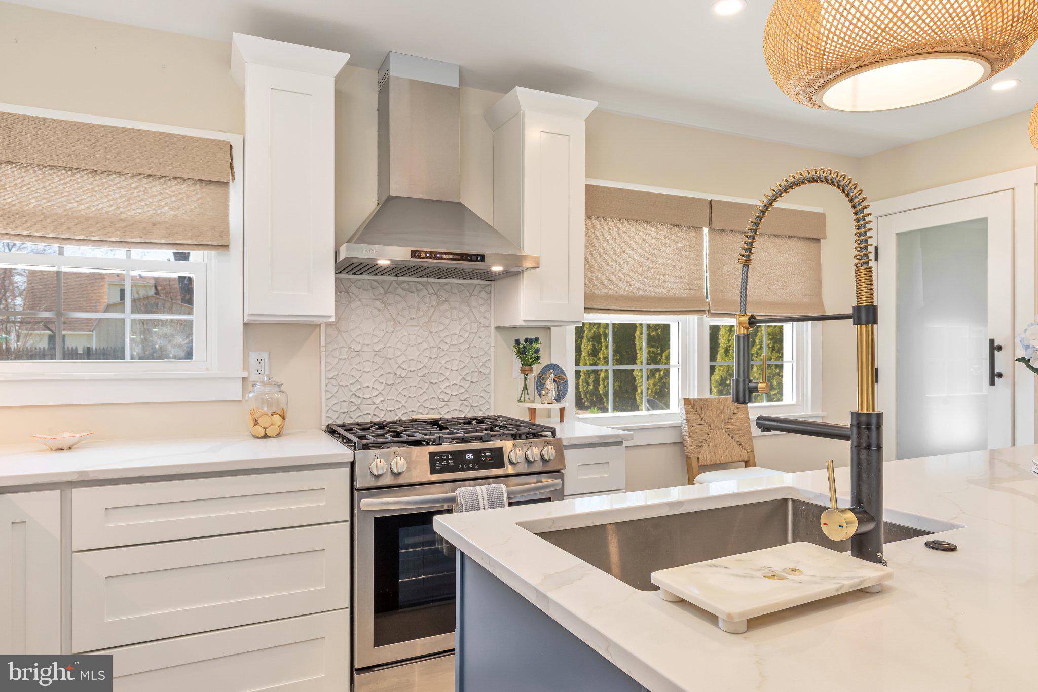 126 Colwick Drive Somers Point, NJ 08244 - Photo 15 of 46 a kitchen with a stove a sink and a window