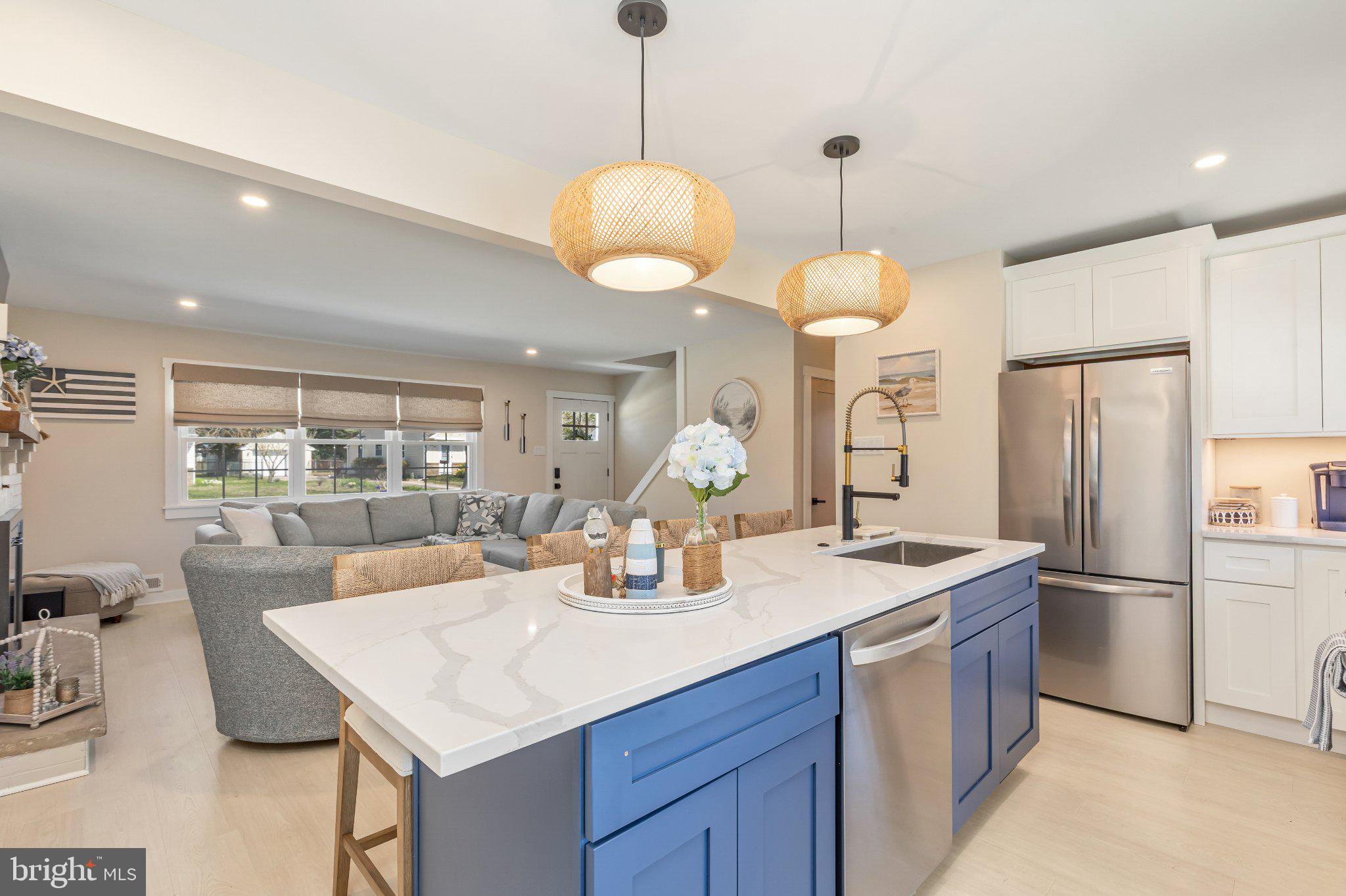 126 Colwick Drive Somers Point, NJ 08244 - Photo 17 of 46 a dining room with granite countertop a table chairs and a refrigerator