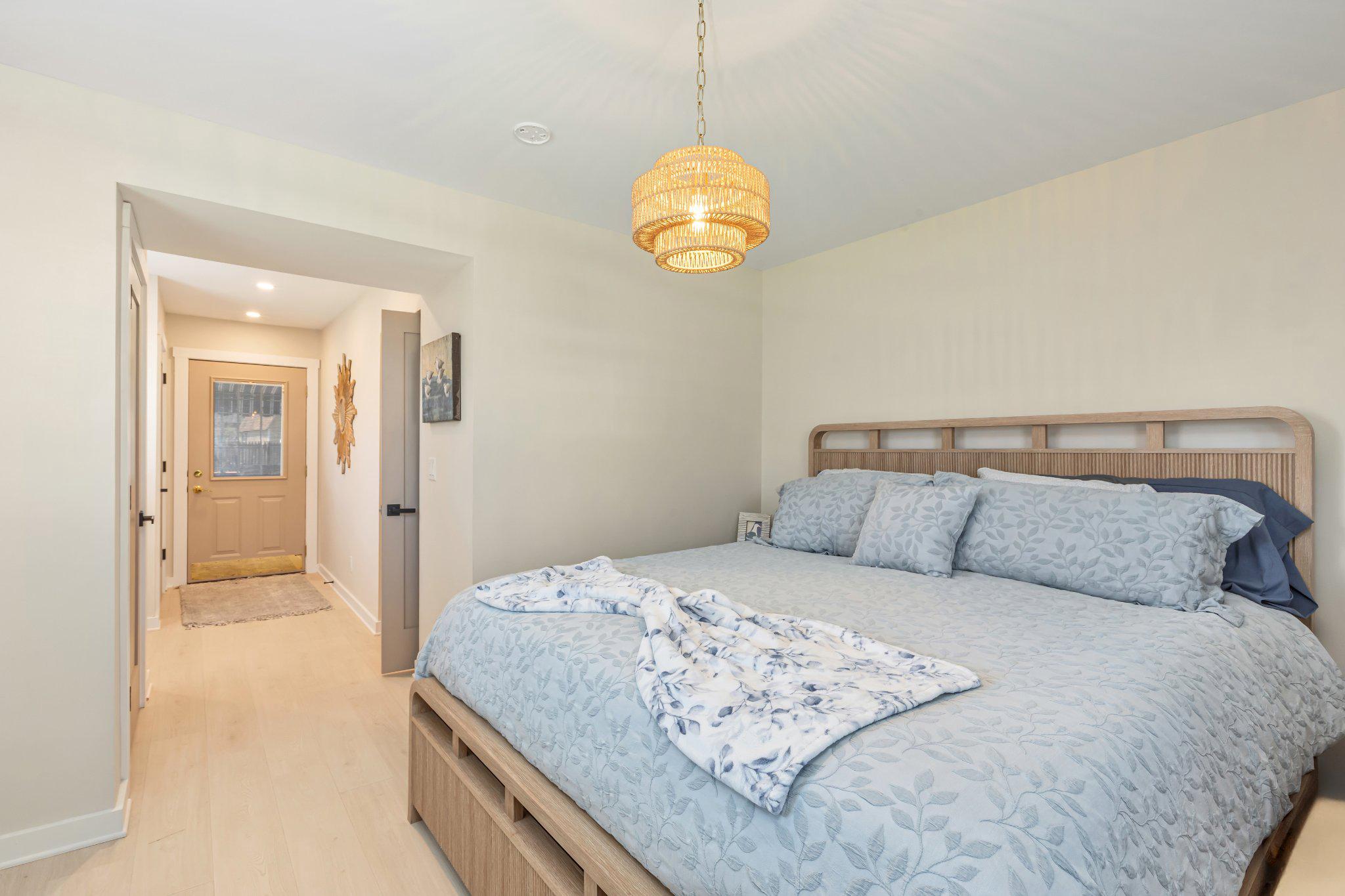 126 Colwick Drive Somers Point, NJ 08244 - Photo 22 of 46 a bedroom with a bed and a chandelier