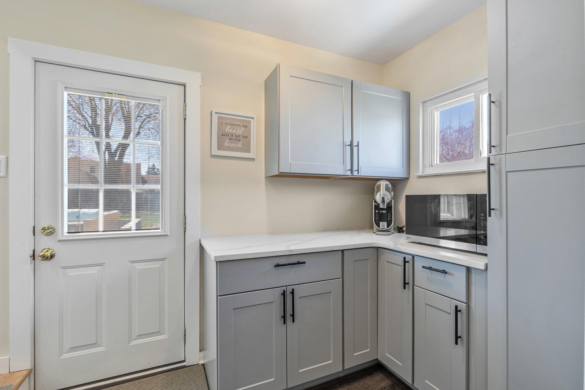 126 Colwick Drive Somers Point, NJ 08244 - Photo 26 of 46 a kitchen with white cabinets and sink