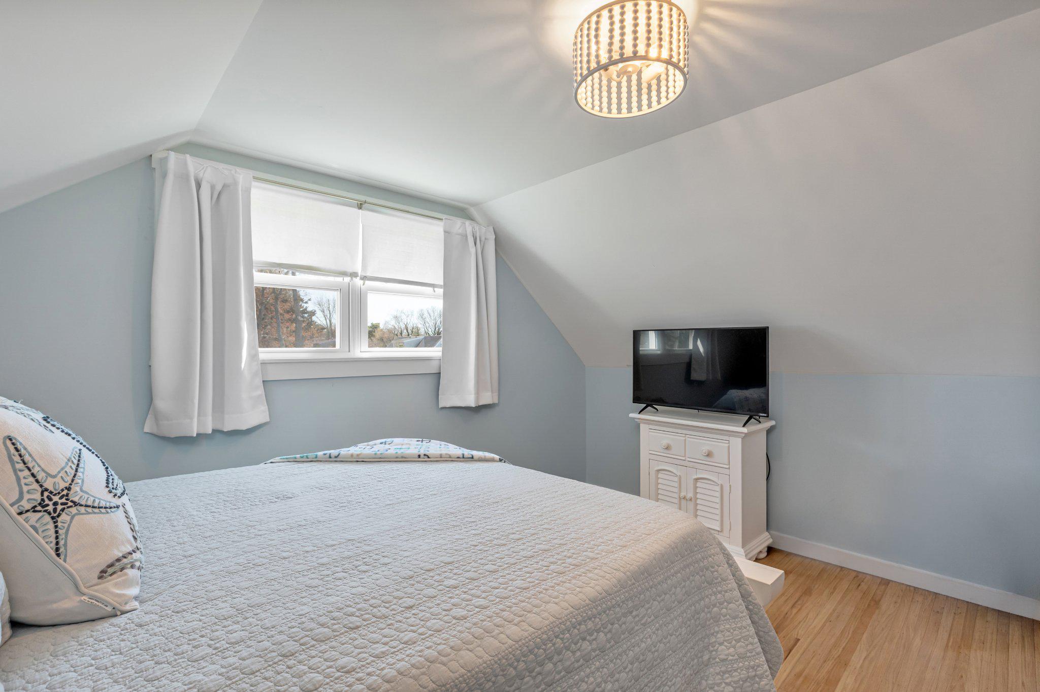 126 Colwick Drive Somers Point, NJ 08244 - Photo 31 of 46 a bedroom with a bed and a flat screen tv