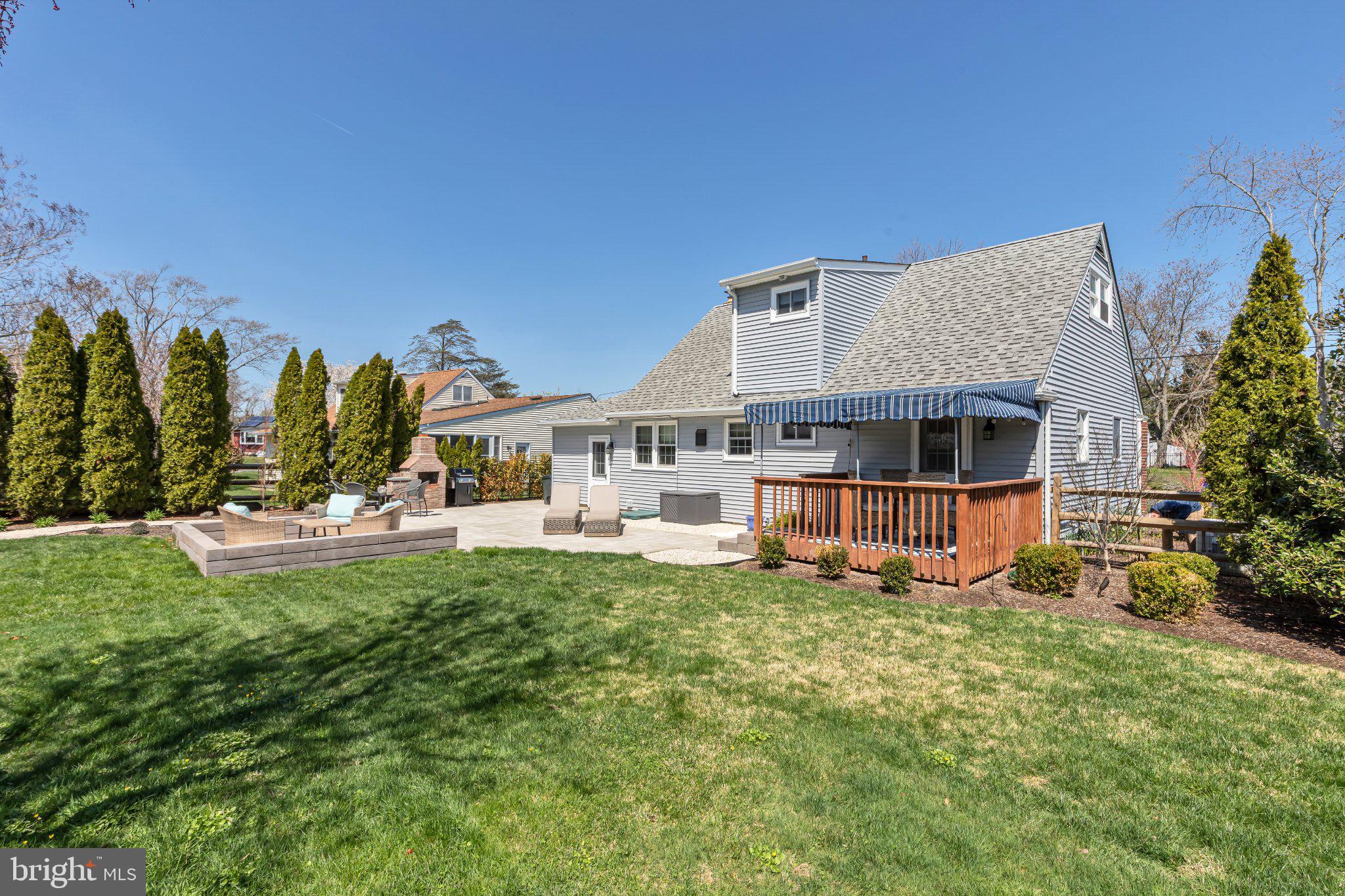 126 Colwick Drive Somers Point, NJ 08244 - Photo 37 of 46 a view of a house with a big yard potted plants and a large tree