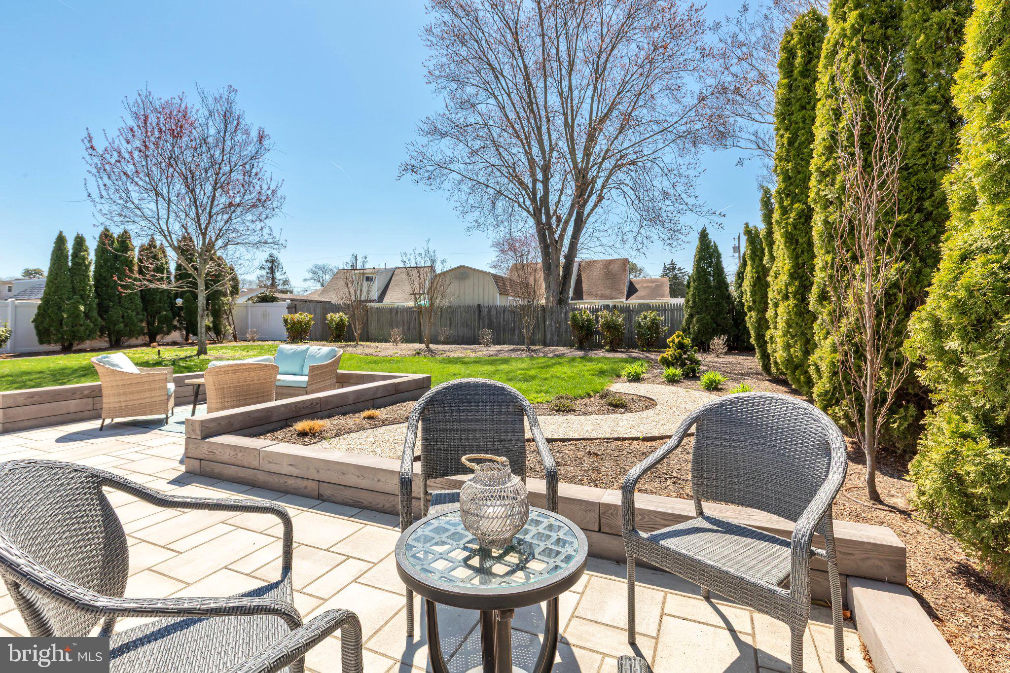 126 Colwick Drive Somers Point, NJ 08244 - Photo 41 of 46 a view of a chairs and table in backyard