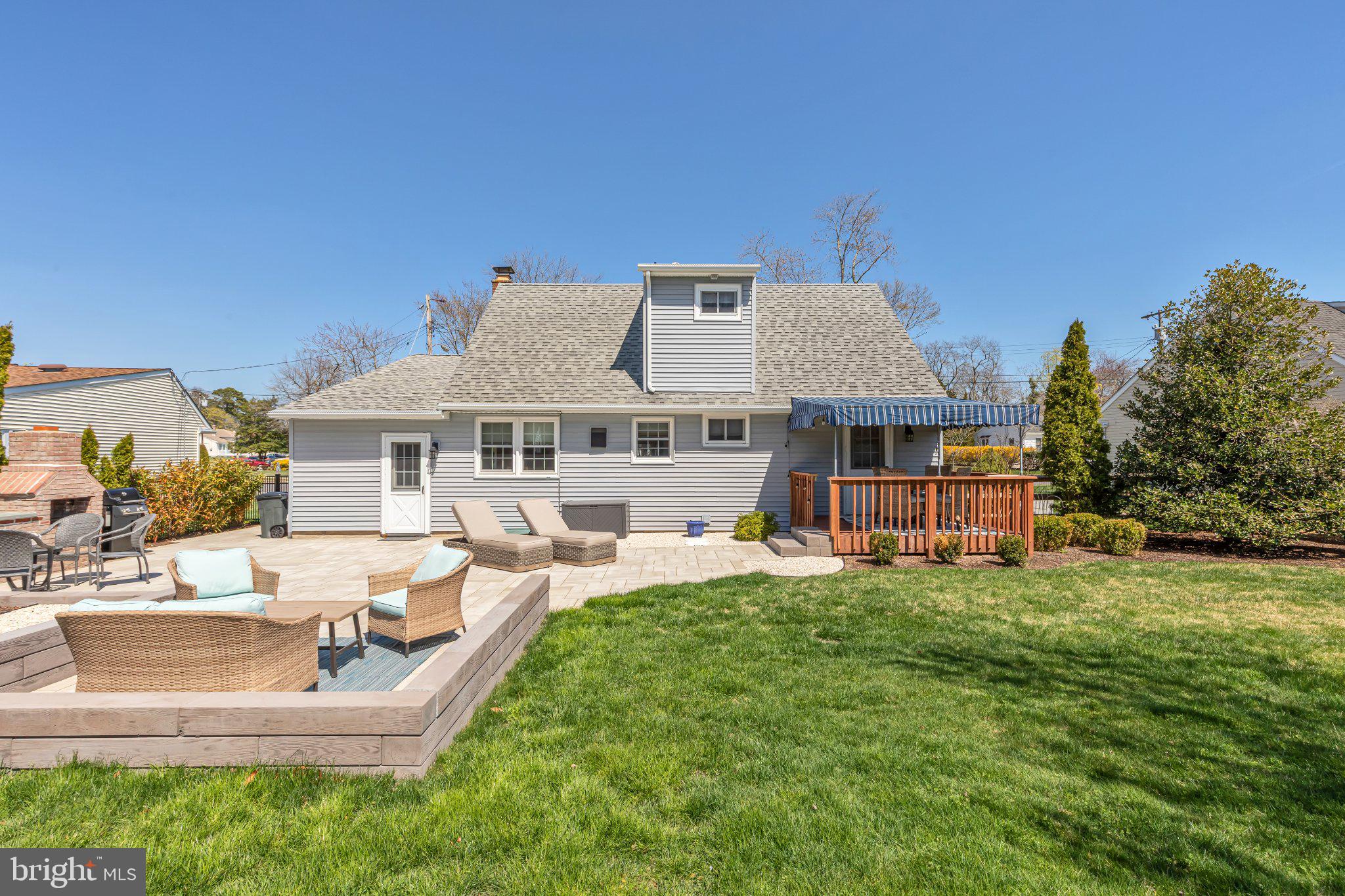 126 Colwick Drive Somers Point, NJ 08244 - Photo 5 of 46 a front view of a house with a yard table and chairs