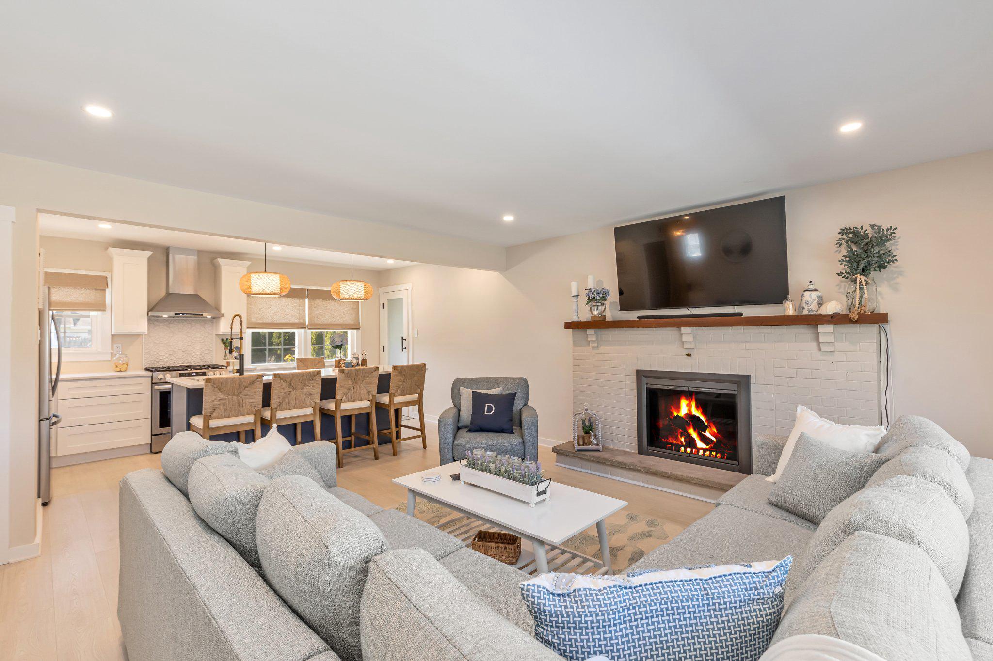 126 Colwick Drive Somers Point, NJ 08244 - Photo 7 of 46 a living room with furniture a fireplace and a flat screen tv