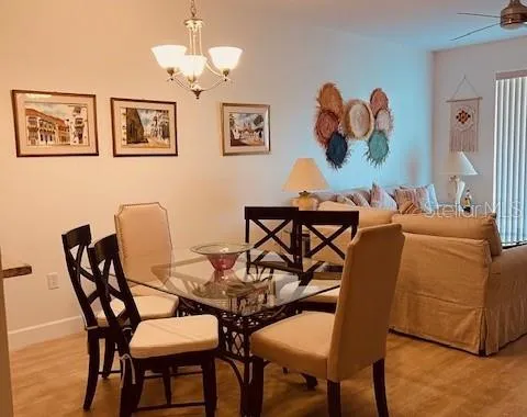 a dining room with furniture and wooden floor