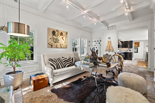 a view of a patio with a table and chairs under an umbrella