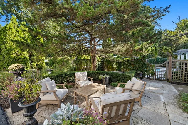 a view of a backyard with sitting area