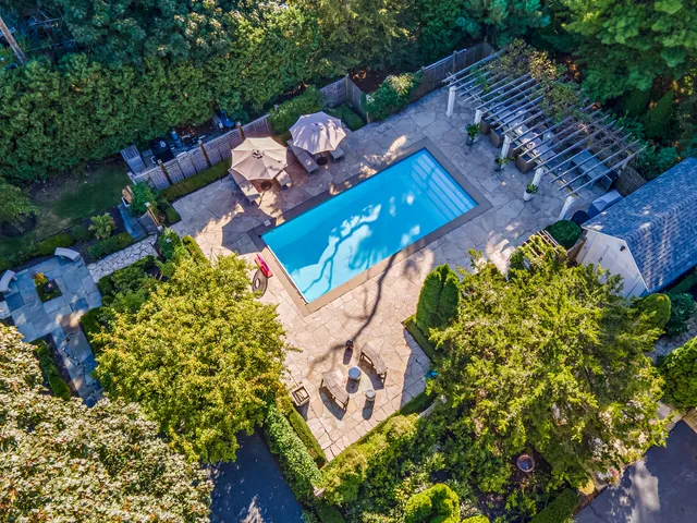 a view of a water fountain in front of the house