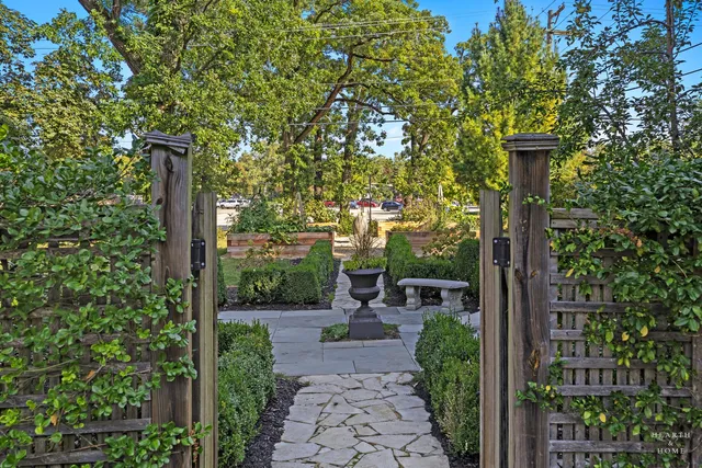 a kitchen with stainless steel appliances granite countertop a stove sink and cabinets
