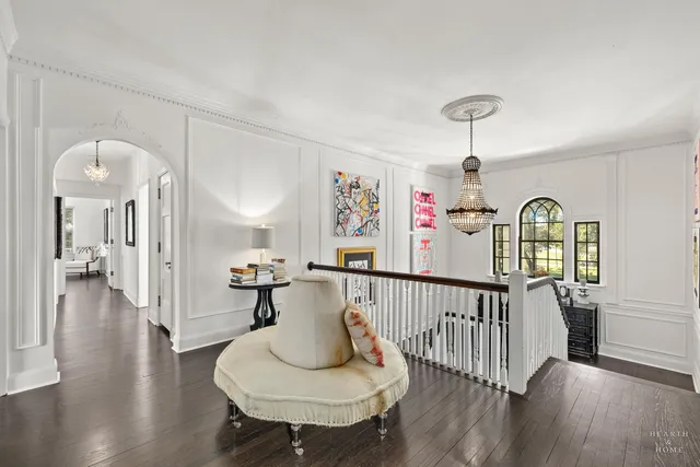 a living room with furniture and a window with garden view