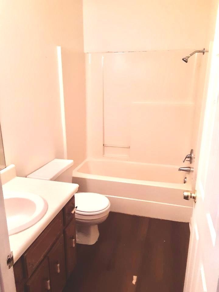 1105 Cumberland Street Decherd, TN 37324 - Photo 3 of 10 a bathroom with a sink a toilet and bathtub