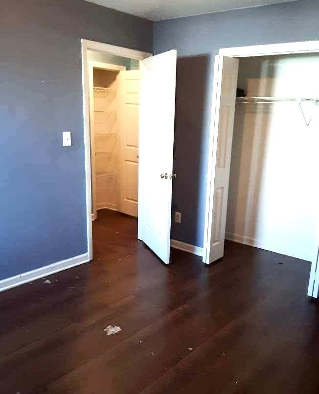 1105 Cumberland Street Decherd, TN 37324 - Photo 4 of 10 an empty room with wooden floor and a window