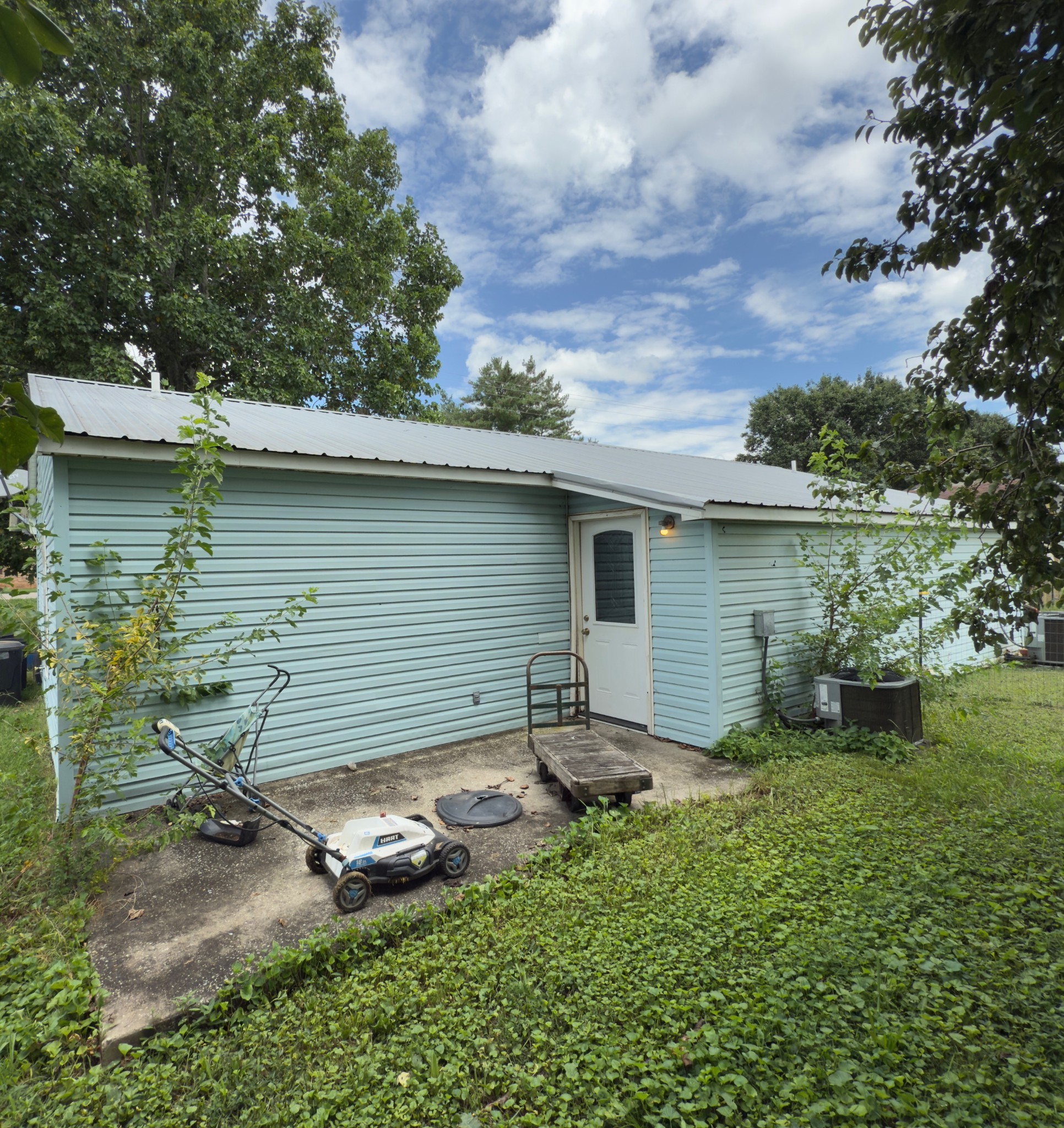 1105 Cumberland Street Decherd, TN 37324 - Photo 9 of 10 a backyard of a house with table and chairs
