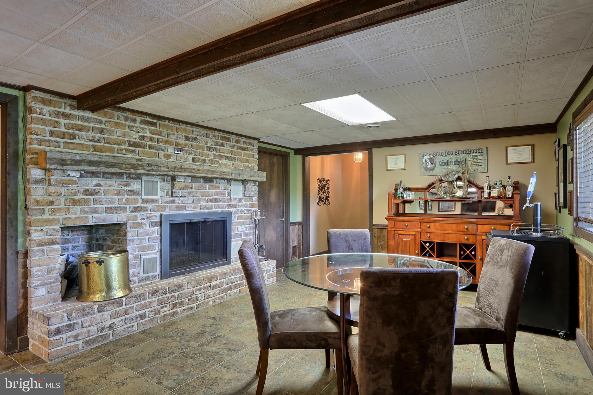 704 Church Road Manheim, PA 17545 - Photo 27 of 46 Family room with wood burning stone fireplace